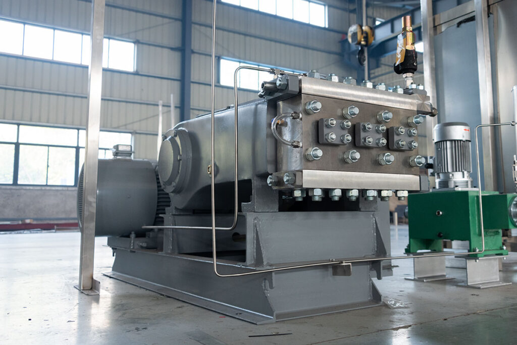 Close-up of the CO2 recovery pump integrated in a 300L industrial supercritical CO2 extraction system, enabling efficient circulation and recycling of carbon dioxide.
