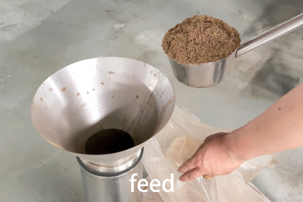 Loading agarwood powder into the extraction basket